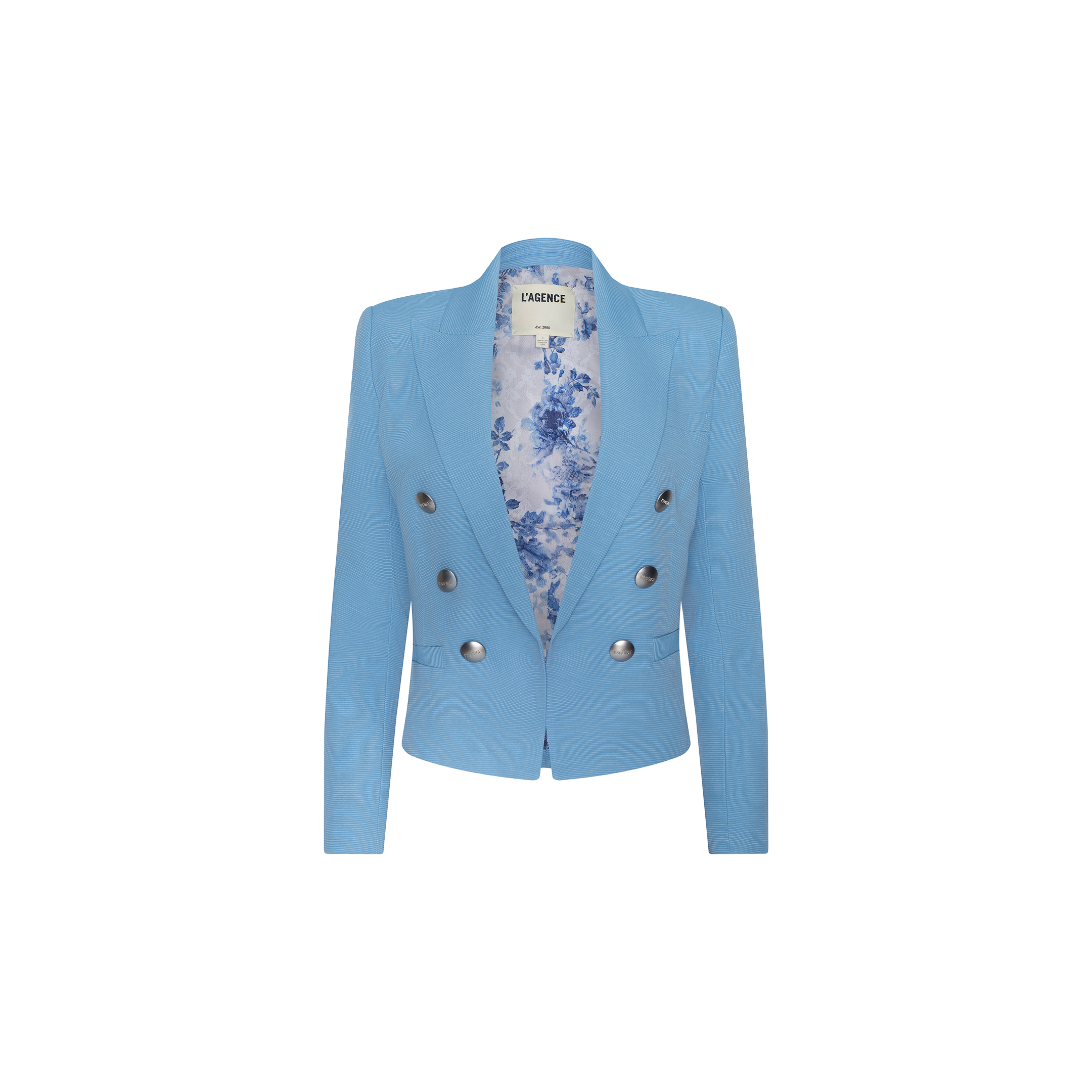The Brooke Blazer is a light blue women’s double-breasted blazer with long sleeves, silver buttons, and a floral-patterned inner lining, crafted from lightweight ribbed fabric and displayed on a plain white background.