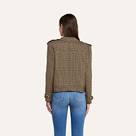 A woman stands with her back to the camera, wearing the Xoey Cropped Trench Coat—a brown plaid double-breasted jacket with gold buttons—paired with light blue fitted jeans, against a plain light background.