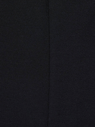 Close-up of the Dee Capri Pant in black stretch ponte fabric, highlighting a visible vertical seam down the center that showcases the material’s texture and stitching details for a flattering fit.