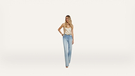 A woman wearing a light-colored tank top and high-waisted blue jeans stands against a plain white background, looking to the side with one hand on her hip.