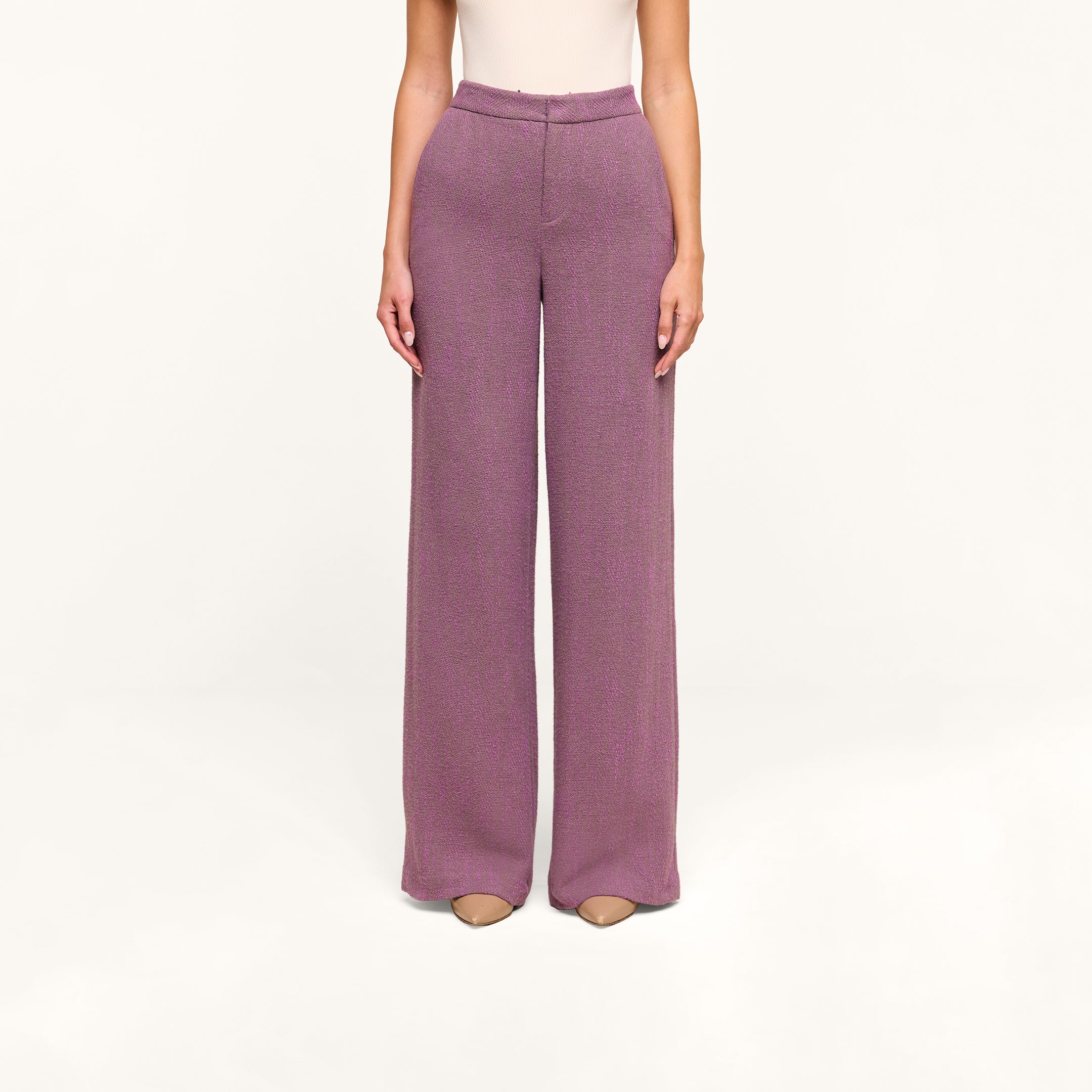A person wearing the Livvy Straight-Leg Trouser in mauve and beige shoes stands against a plain, off-white background, with only the lower half of their body visible.