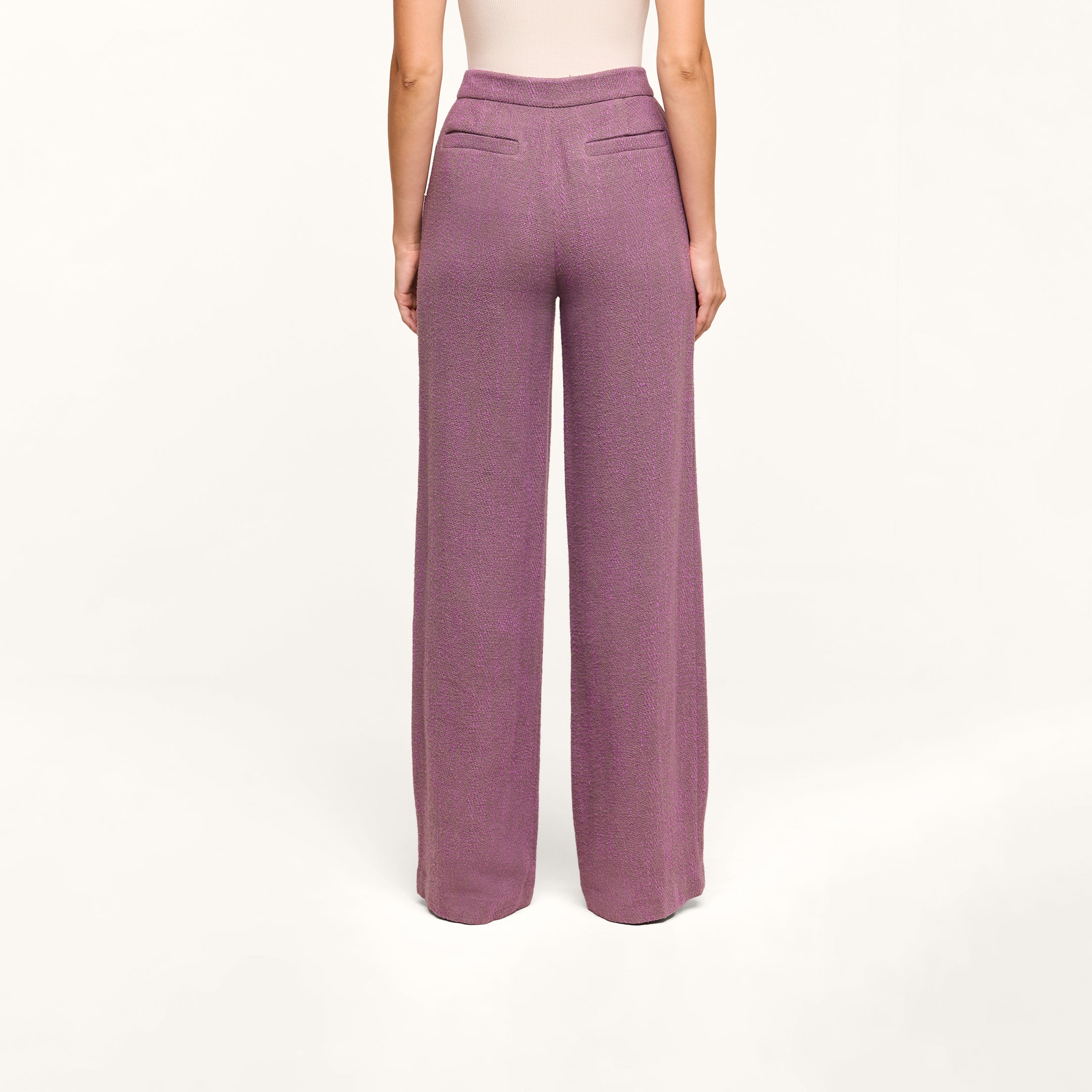 Wearing the Livvy Straight-Leg Trouser, a person stands with their back to the camera against a plain white background.