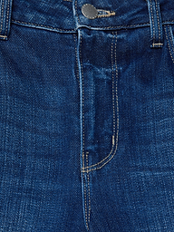 Close-up of the front of the Scottie Wide-Leg Jean in blue stretch denim, highlighting the contoured waistband, button, belt loops, zipper area, and part of the front pocket with visible stitching.