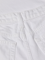 Close-up of the waistband and upper back pockets of the Joanne Low-Rise Wide-Leg Jean in white wash denim, highlighting the stitching details and belt loop.