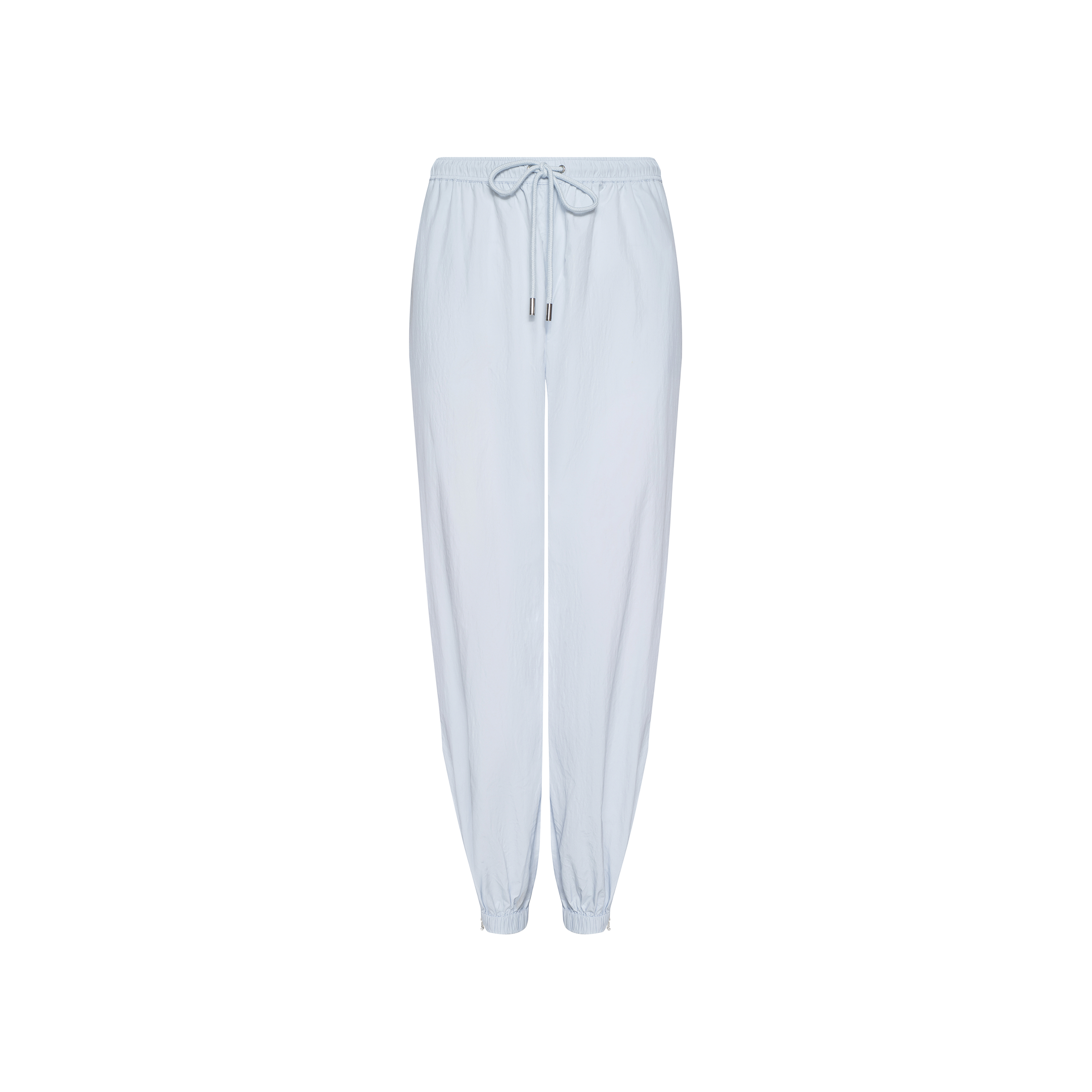 The Mariko Jogger, made from light blue lightweight nylon, features an elastic waistband with a drawstring tie and elastic cuffs at the ankles, shown against a white background.