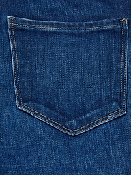 Close-up of the back pocket on the Celestia Slim-Leg Jean, featuring blue denim and visible yellow stitching around the edges.