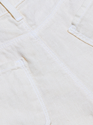 Close-up of the Amara Linen Wide-Leg Pant in a light color, highlighting visible stitching, part of a pocket, and the seam.