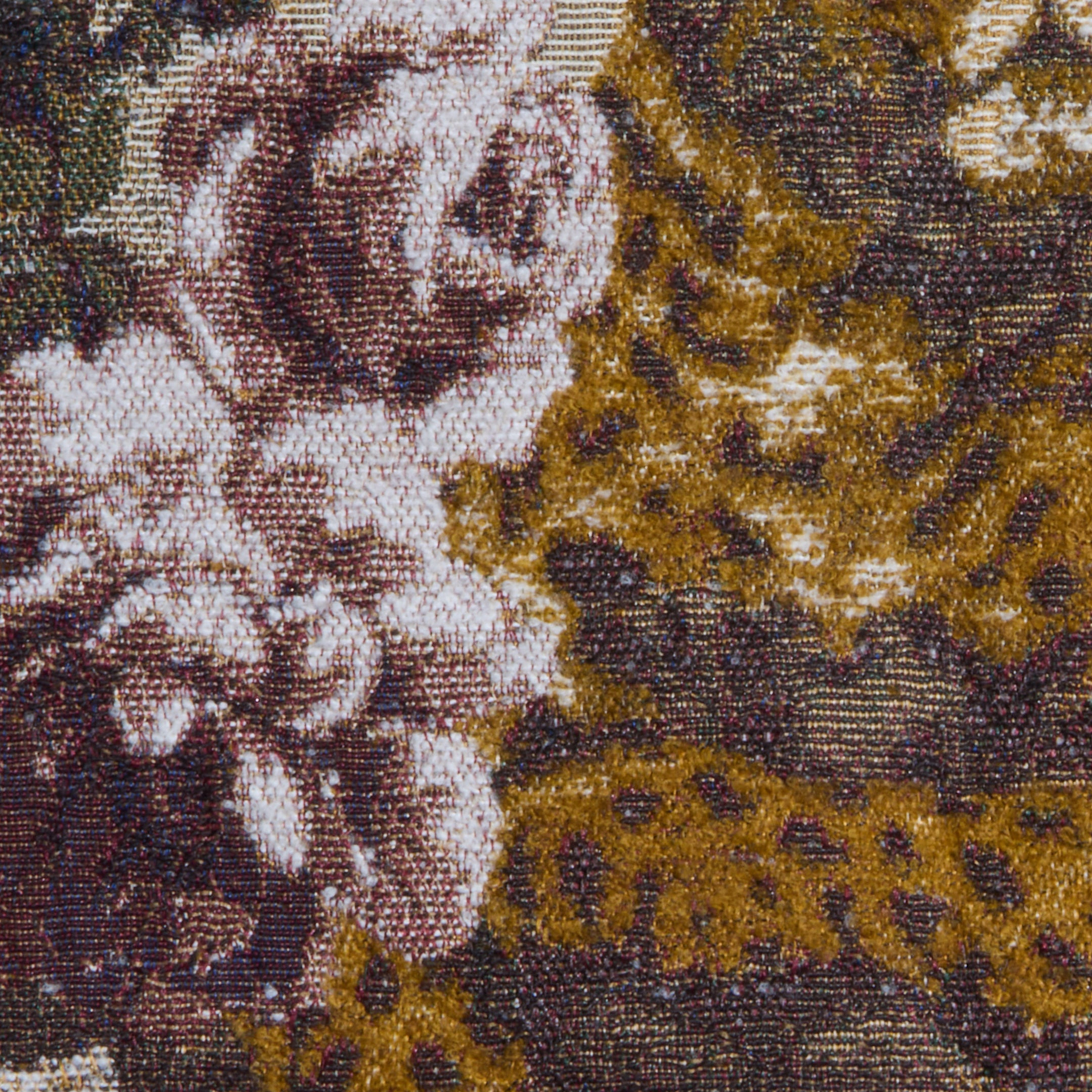 Close-up of the Marseille Mini Skirt, crafted from Italian jacquard tapestry fabric featuring pink and white flowers with green leaves, set against textured brown and gold patterns.
