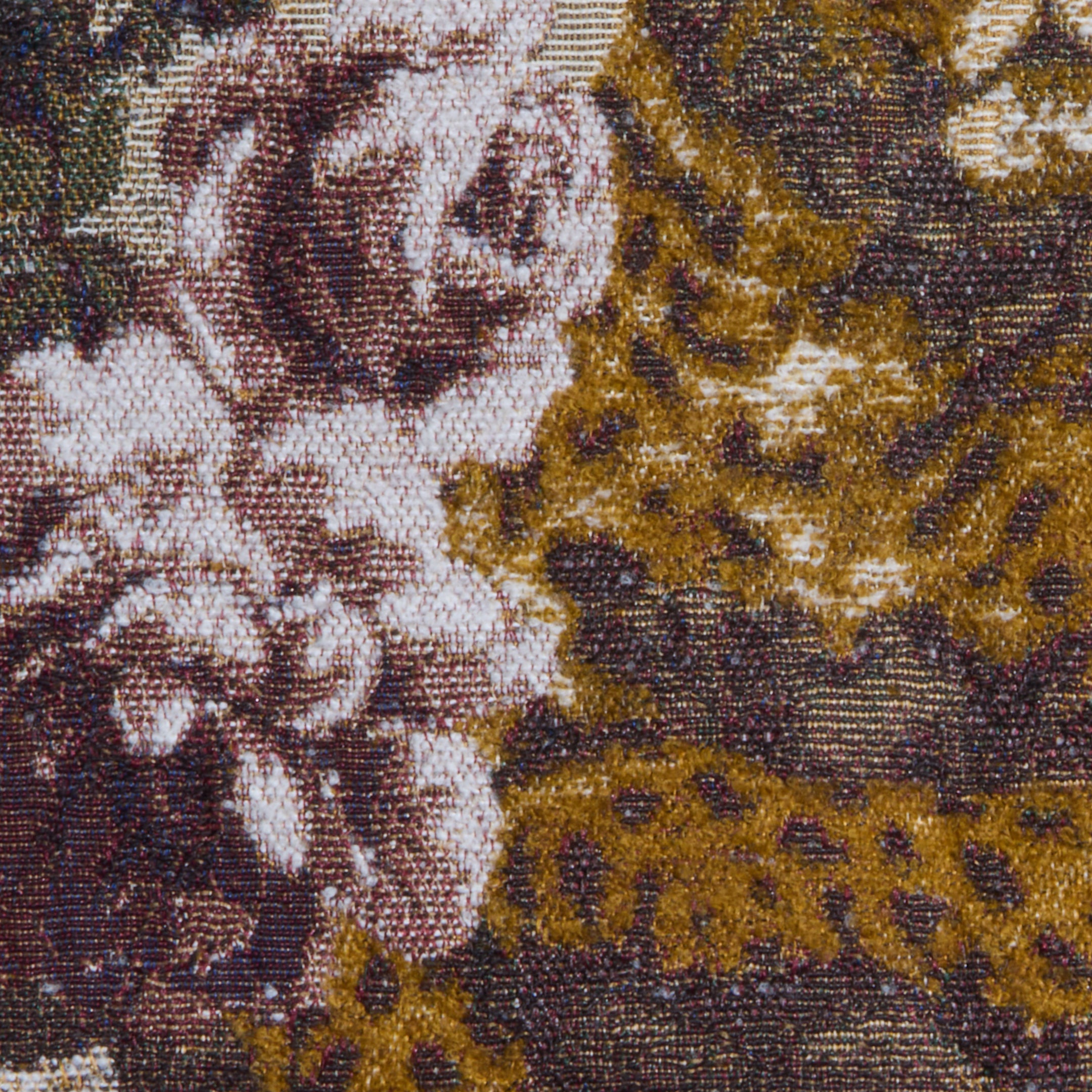 Close-up of the Marseille Mini Skirt, crafted from Italian jacquard tapestry fabric featuring pink and white flowers with green leaves, set against textured brown and gold patterns.