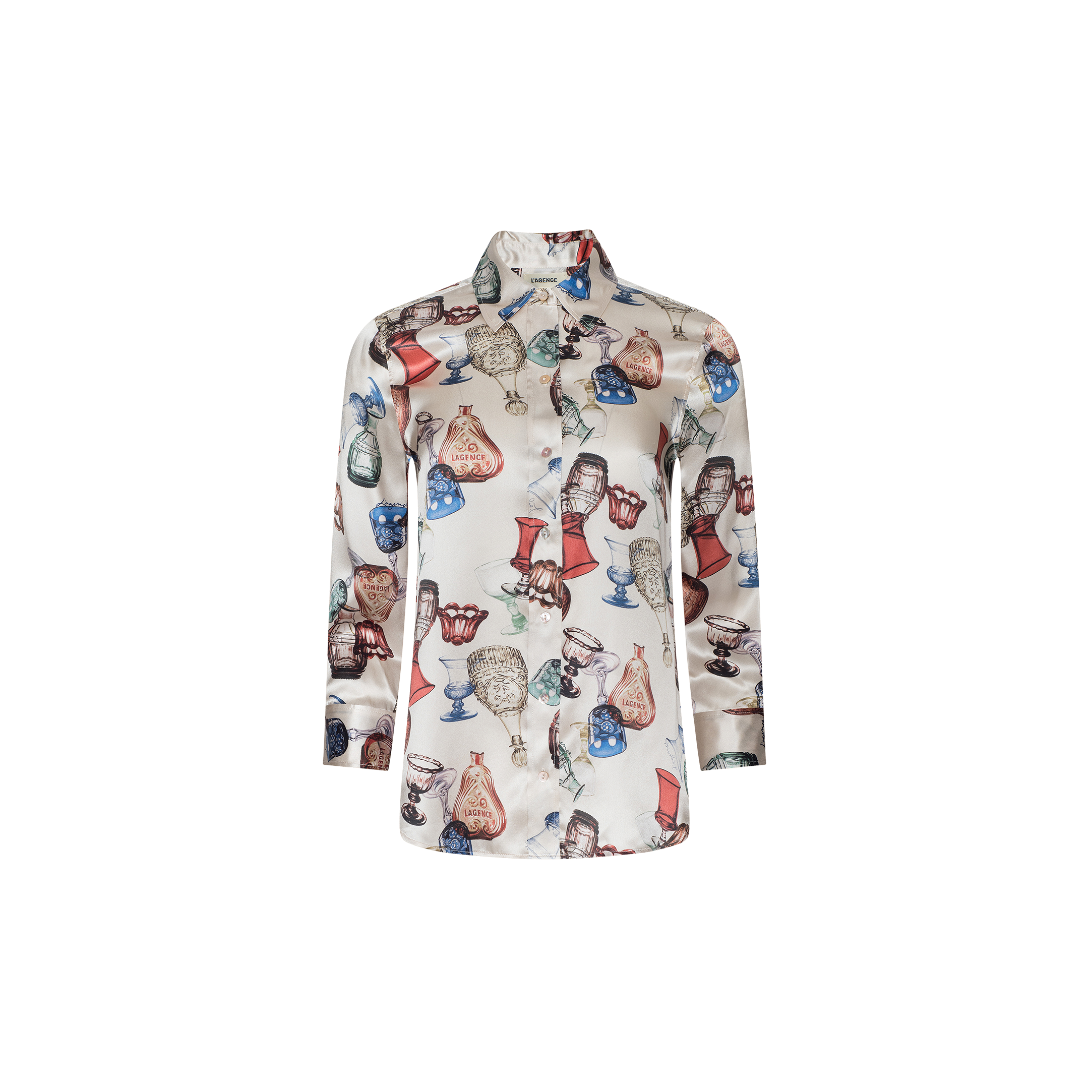 The Dani Silk Blouse is a long-sleeve button-down shirt crafted from silk, featuring a white base adorned with vibrant illustrations of vintage glassware—including wine glasses and goblets—in shades of red, blue, and brown.