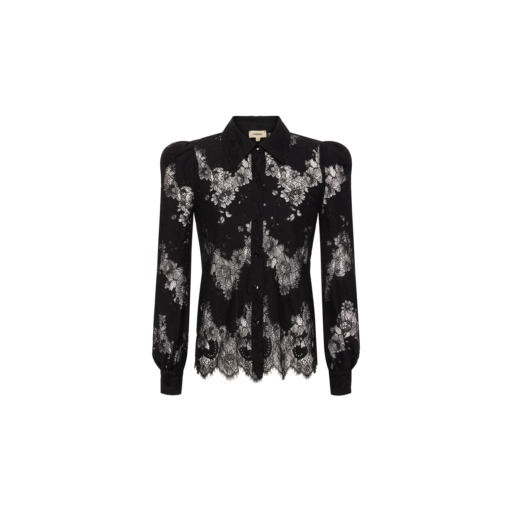 The Jenica Lace Blouse is a black lace blouse with delicate floral patterns, a collared neckline, button-down front, and scalloped hem. This feminine button-up features semi-sheer lace detailing and puffed shoulders, showcased against a plain white background.