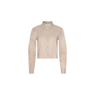 The Cosette Shirt is a beige, long-sleeve collared tailored shirt featuring subtle pinstripes, cropped at the waist with a high-low hem, displayed on a plain white background.