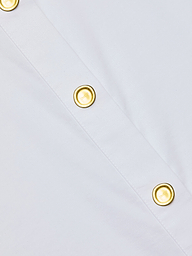 Close-up of the Cosette Shirt, a white poplin design featuring two gold-colored buttons aligned along a diagonal seam.