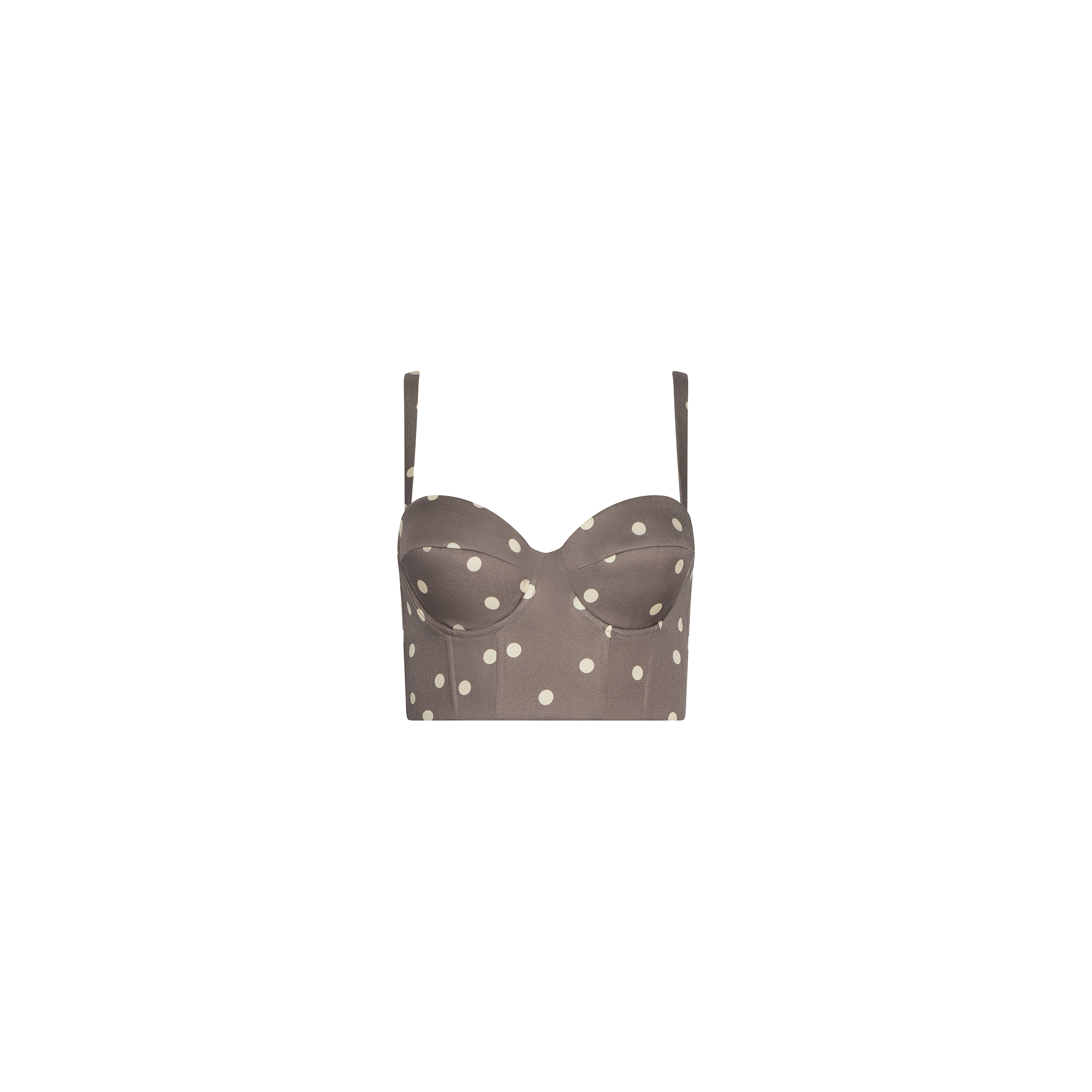 The Sonya Bustier is a brown cropped top made from lightweight twill, featuring thin adjustable straps, a smocked back, and a cardamom polka dot pattern, displayed on a plain white background.