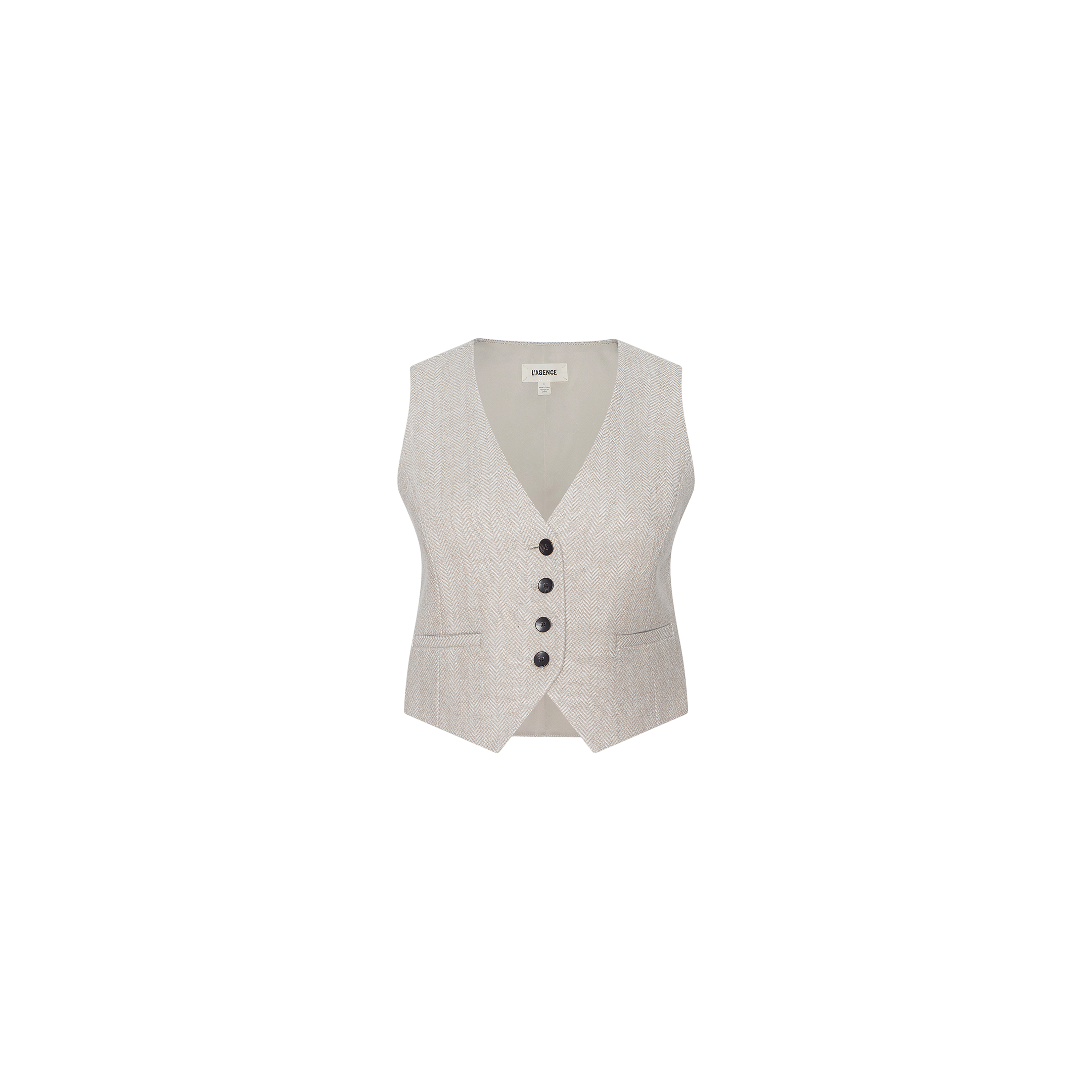 The Jianna Vest is a light beige herringbone tweed cropped vest featuring a V-neckline, four black buttons down the front, and two small front pockets, showcased against a plain white background.
