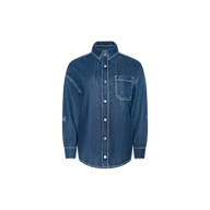 The Jorah Oversized Shirt is a long-sleeve, button-up shirt crafted from featherweight denim, featuring a single chest pocket, visible white stitching, and a classic collar. It is displayed on a plain white background.