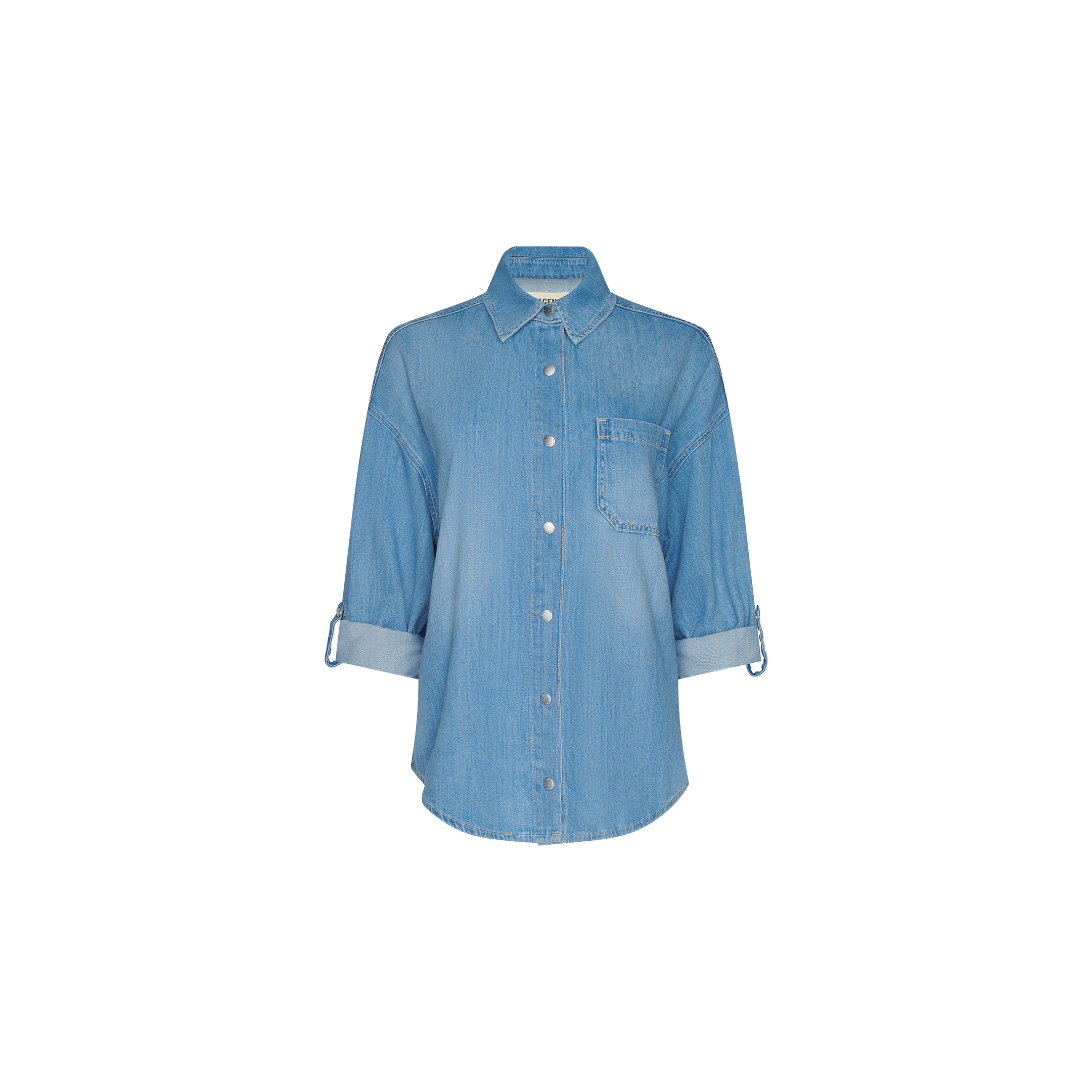 The Jorah Oversized Shirt is a light blue denim shirt featuring long sleeves, a front chest pocket, snap buttons, and rolled cuffs, shown against a plain white background.