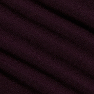 Close-up of the Lani Turtleneck’s deep purple fabric with a diagonal ribbed texture and soft, matte finish—ideal for Fall 2026. The material appears smooth, with gentle shadows accentuating the folds.