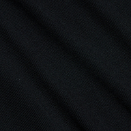 Close-up of the Wrenna Racerback Bodysuit in black, featuring fine ribbed fabric with subtle diagonal textured lines and soft folds. The lighting accentuates the material’s delicate sheen and detailed pattern.
