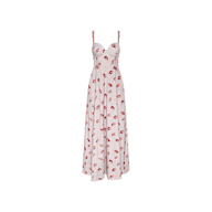 The Sutton Maxi Dress is a sleeveless, white dress adorned with a lipstick-kiss print throughout. It features a sweetheart neckline, thin beaded straps, and a fitted bodice that flares into a flowing skirt.