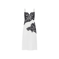 The Fenna Silk Lace Dress is a sleeveless white silk charmeuse midi slip dress with black lace detailing across the bust and midsection, displayed on a plain white background.
