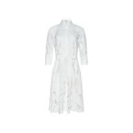 May Eyelet Shirt Dress—crafted from white cotton with eyelet detailing, this midi dress features long sleeves, a button-down front, collar, and a matching fabric waist tie. Shown against a plain white background.