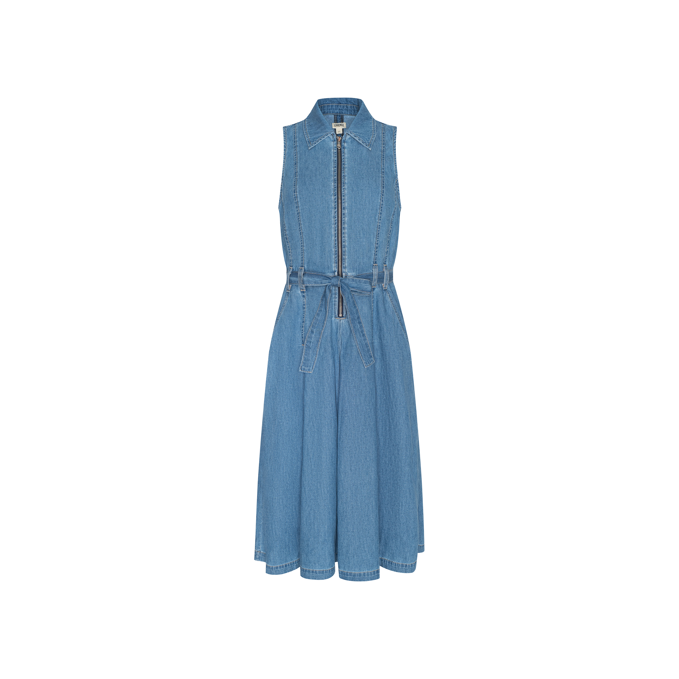 The Kieran Shirt Dress is a sleeveless, blue featherweight denim design featuring a front zipper, classic collar, and tie belt at the waist. Its flared, knee-length skirt is showcased against a plain white background.