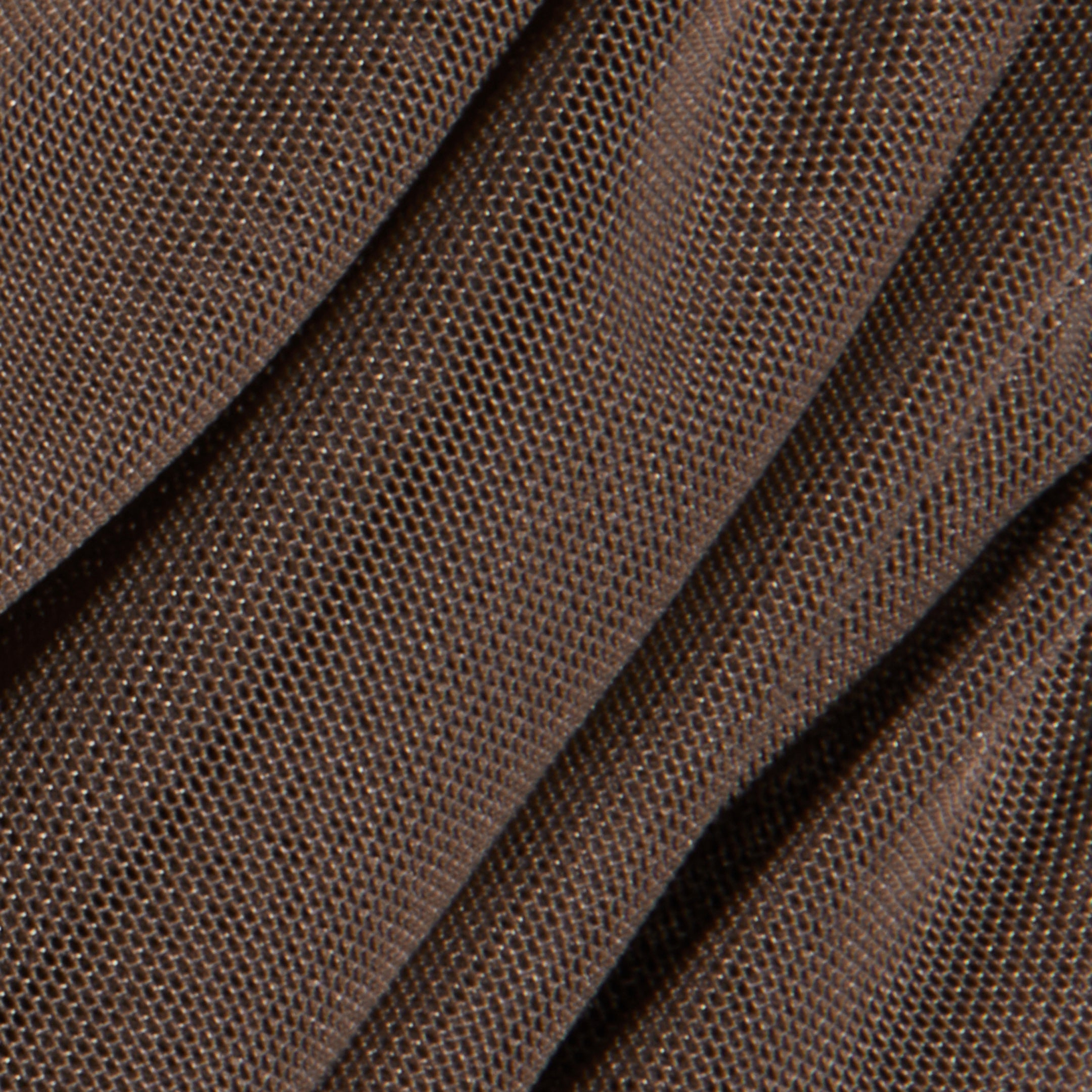 Close-up of folded brown textured fabric with a fine, grid-like weave pattern, casting soft shadows and subtle highlights across the material—a detail that would add depth to the Anya Shirred Dress or enhance its form-hugging silhouette.