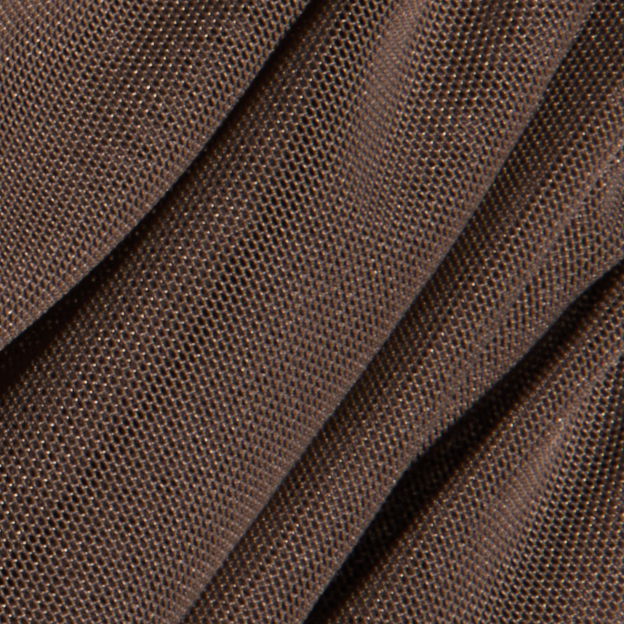 Close-up of folded brown textured fabric with a fine, grid-like weave pattern, casting soft shadows and subtle highlights across the material—a detail that would add depth to the Anya Shirred Dress or enhance its form-hugging silhouette.
