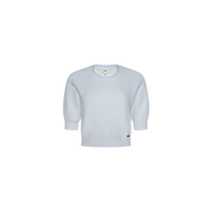 Guinevere Cropped Pullover in light blue features a soft knit texture, long sleeves with ribbed cuffs, and a classic crewneck silhouette, shown against a plain white background.