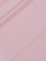 Close-up of the Taren Knit Dress in pink, featuring power knit fabric with diagonal lines and a section of intricate crochet or lace detailing, creating a textured and patterned appearance.