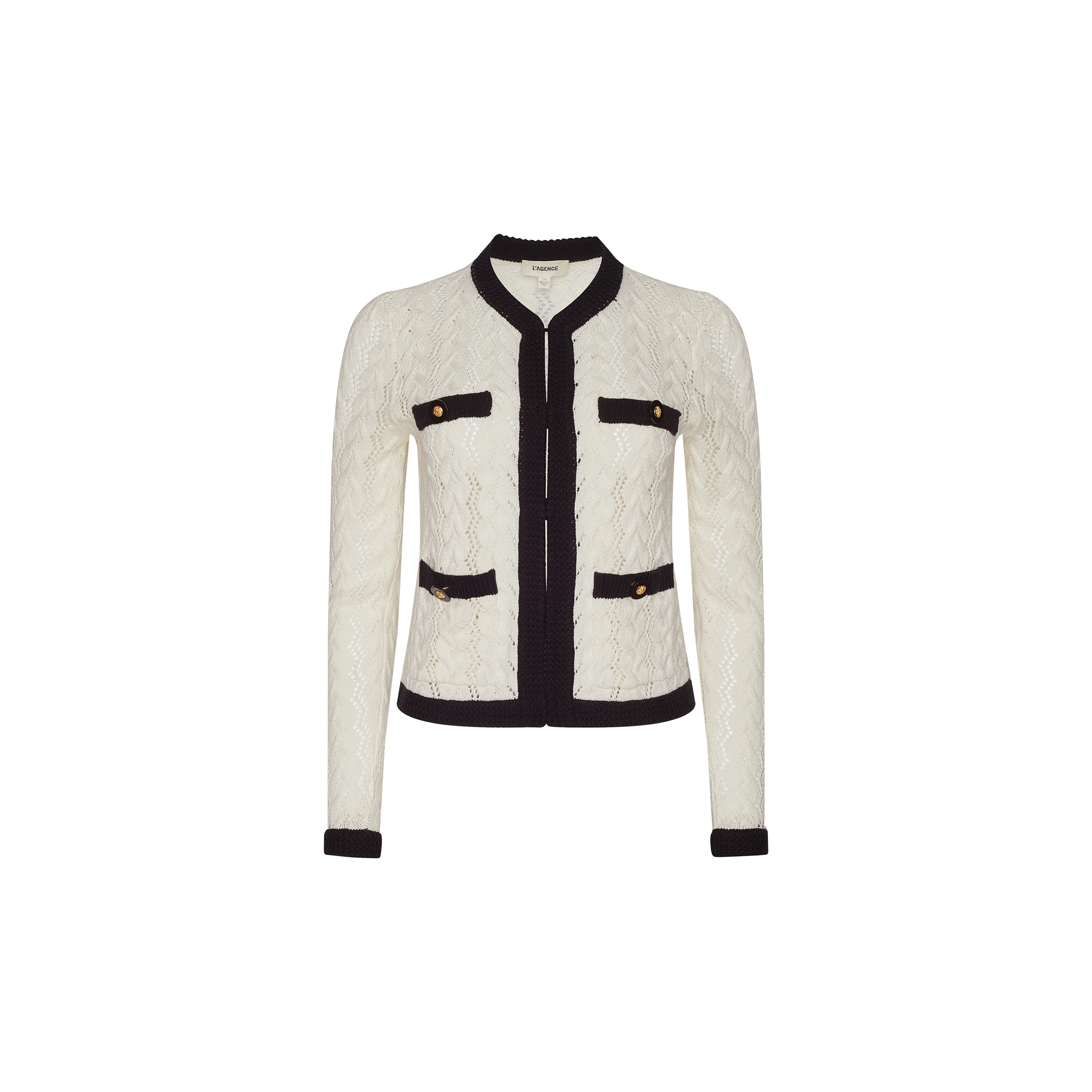 The Zephyra Pointelle Knit Cardigan is a white textured women’s jacket with black trim, featuring four front pockets finished with decorative gold buttons. It has a round neckline and an open front, presented on a plain white background, echoing the timeless style of the classic Zephyra cardigan.