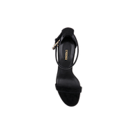 Top view of a single Gisele Suede Sandal in black with an ankle strap and gold buckle, featuring the brand name LAURENCE printed in gold on the insole, set against a white background.