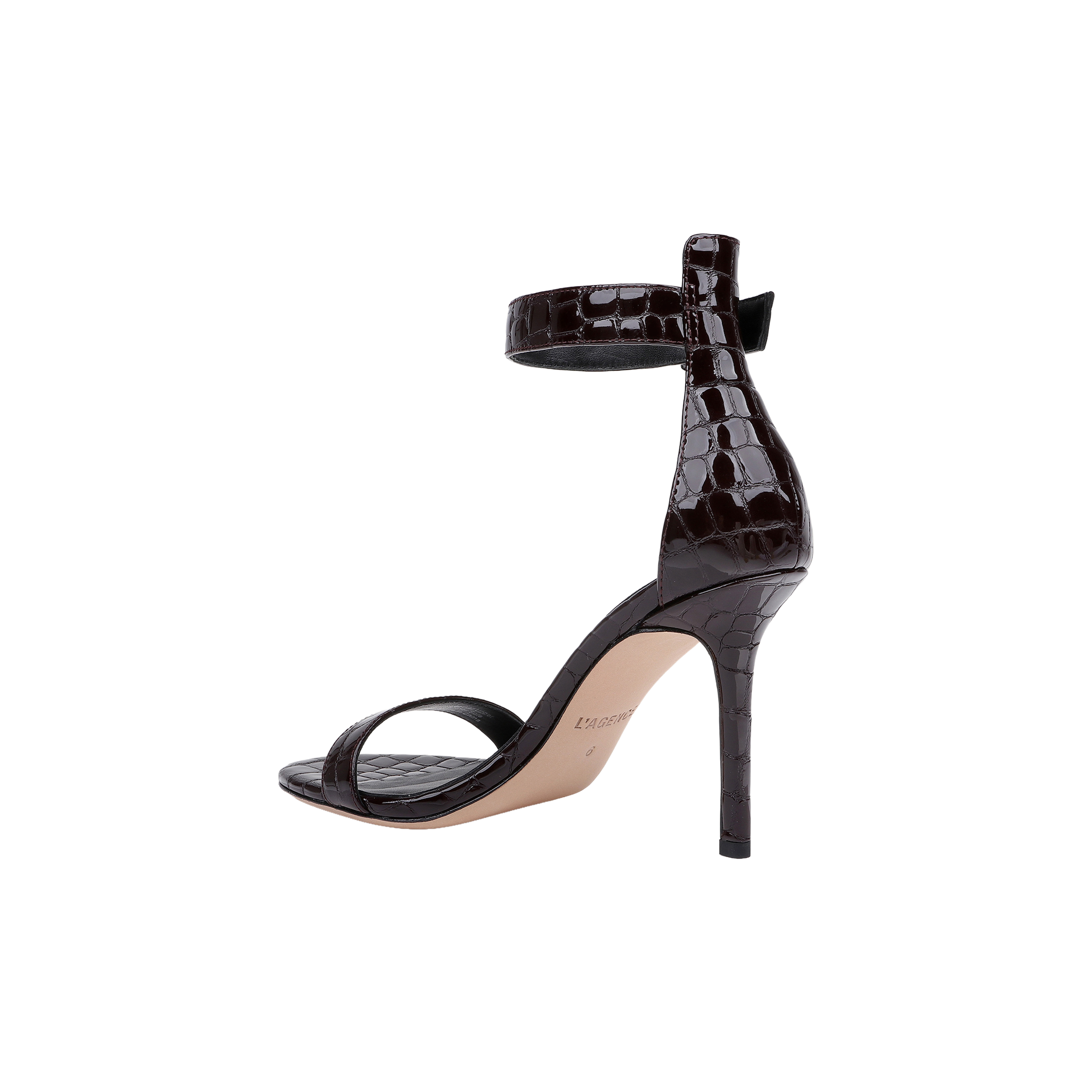 A Gisele Leather Sandal in black crocodile-embossed leather, featuring a high heel, ankle strap, and open toe, displayed against a plain white background.