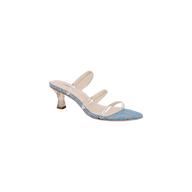 The Ludovica Kitten-Heel Sandal is a fashionable denim mule featuring a blue denim sole, three clear vinyl straps across the foot, and a translucent curved heel, displayed on a white background.