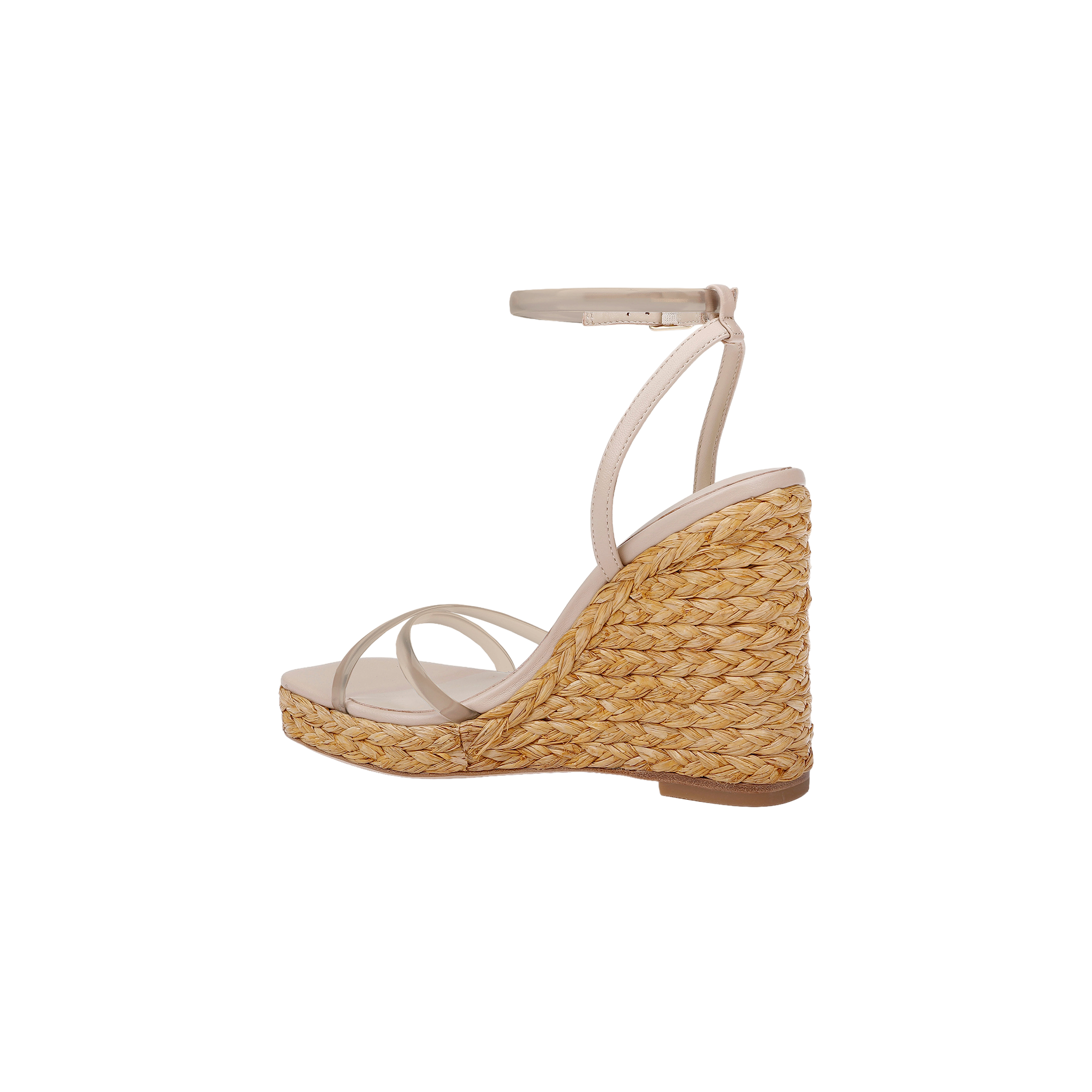 The Malone Wedge Espadrille is a beige strappy sandal with a high raffia wedge heel crafted from woven straw, featuring an ankle strap and a slightly open toe, shown against a white background for an effortless bohemian style look.