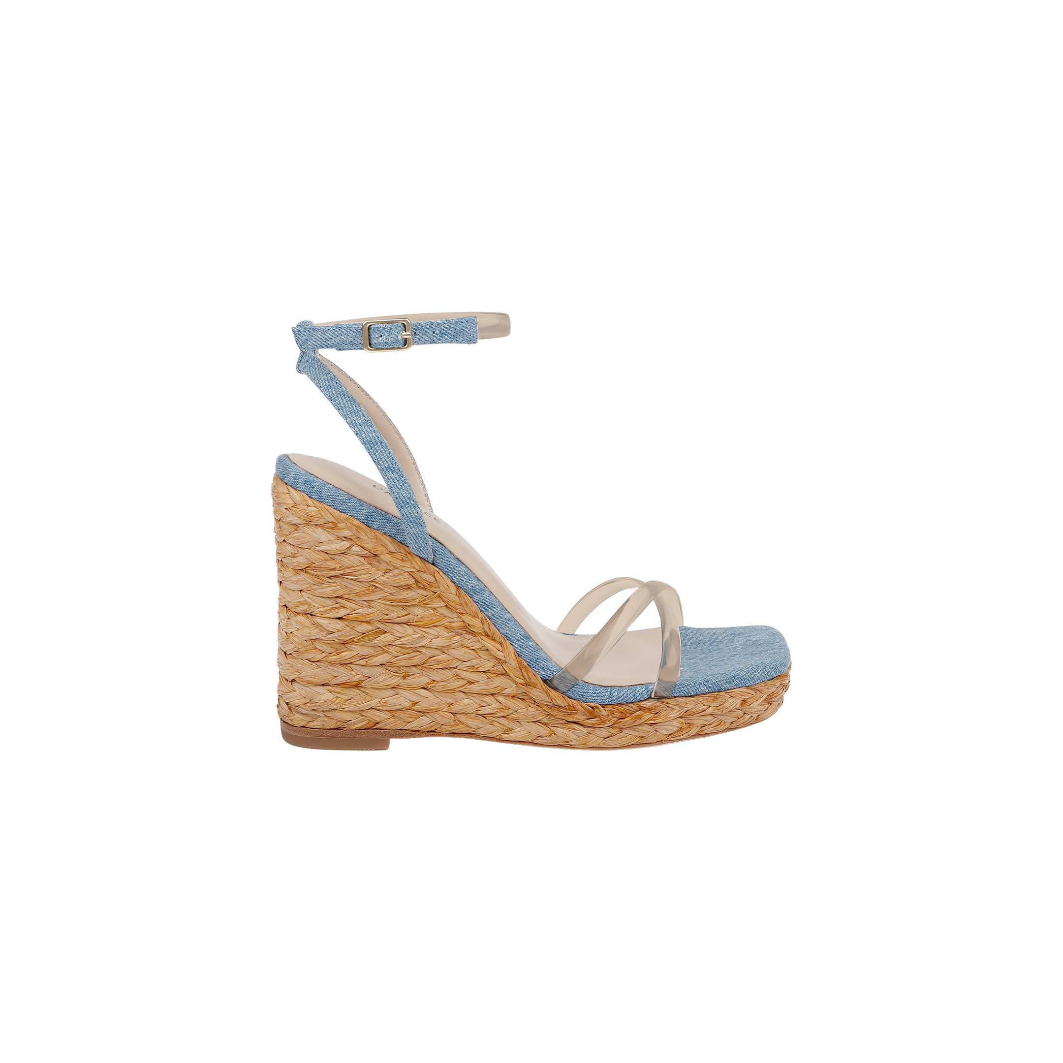 The Malone Wedge Espadrille is a bohemian sandal featuring a woven straw heel, light blue ankle strap, and clear toe straps, shown on a white background.