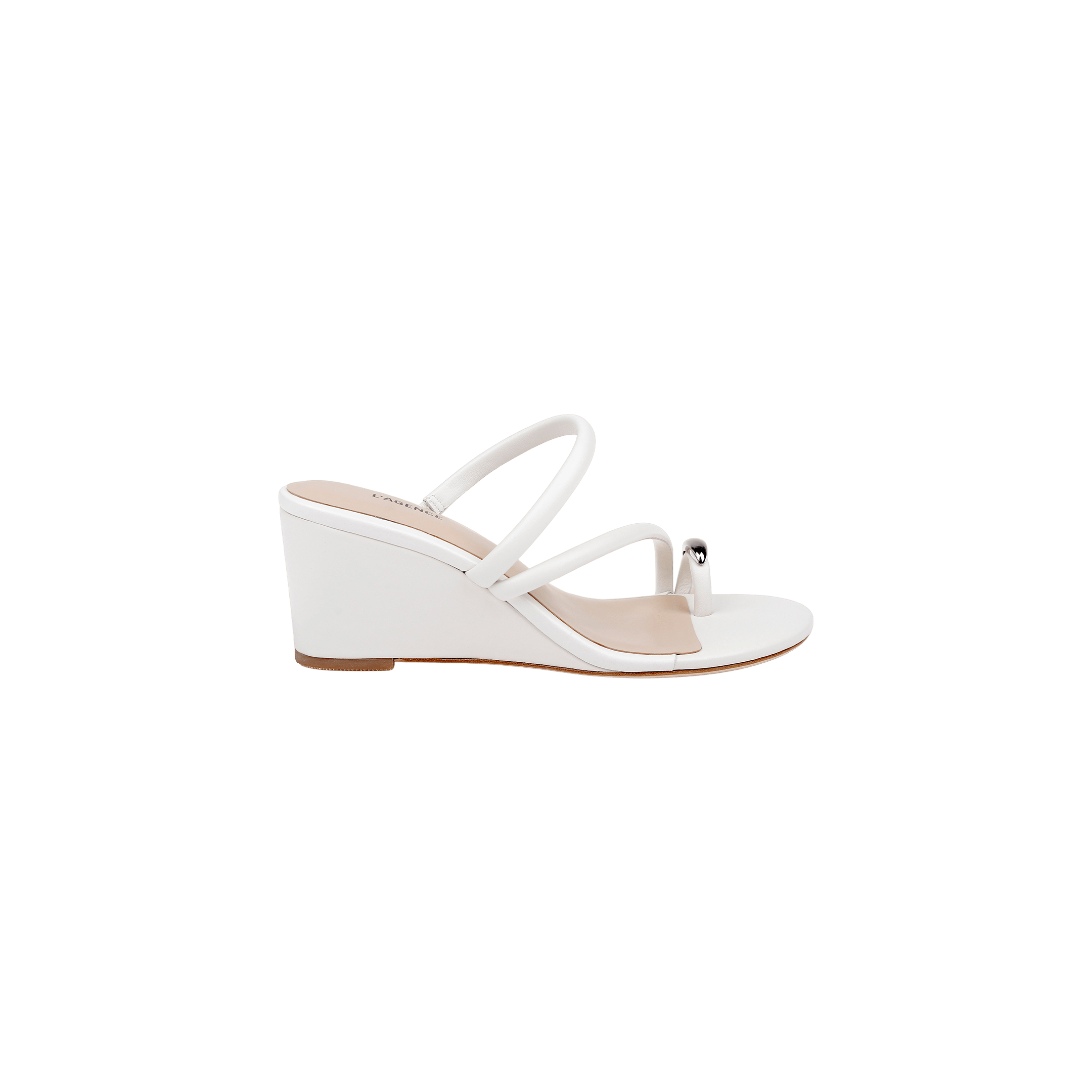 The Maritza Wedge Sandal is a white wedge sandal with two slim straps and a decorative silver bead near the toe. It features an open toe, a comfortable walkable wedge, and a low wooden sole.