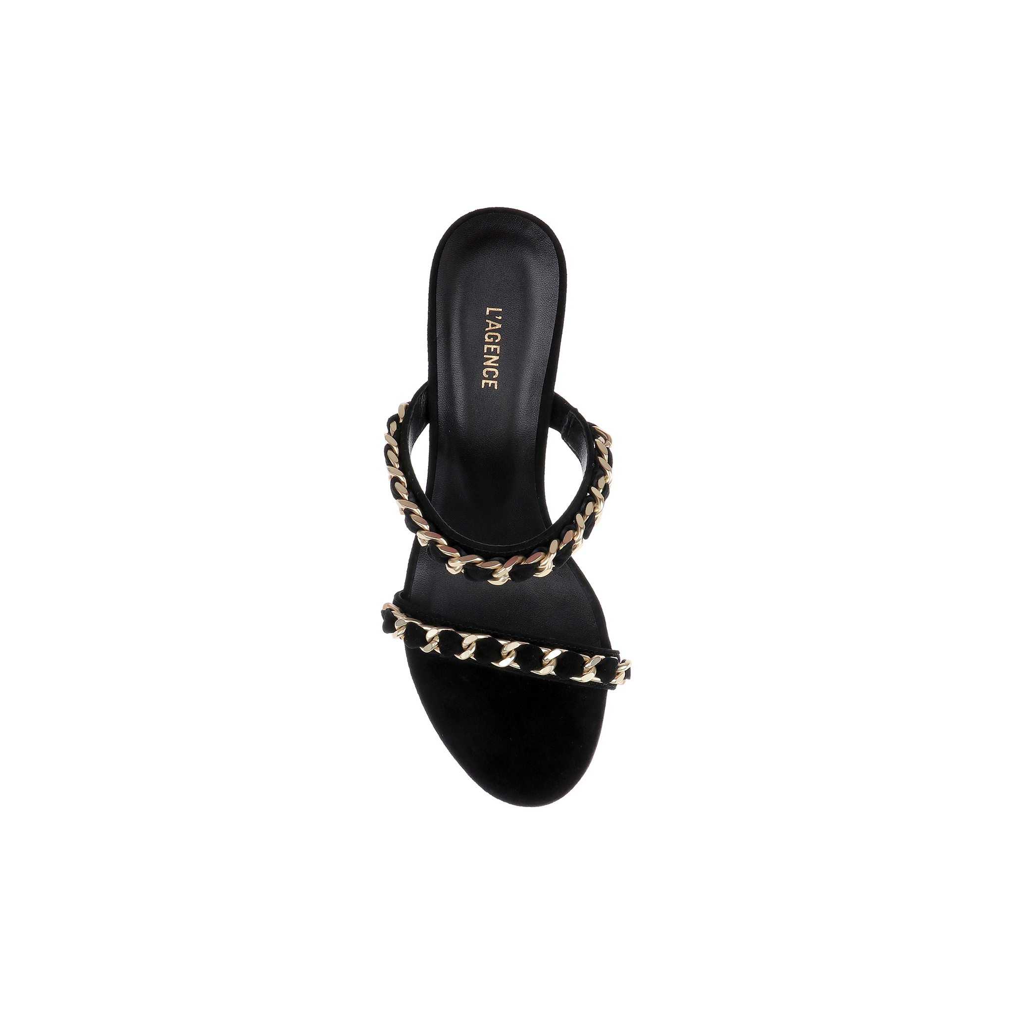 The Sarika Chain Sandal is a black suede, open-toe high-fashion sandal highlighted by two gold chain-embellished straps and “L’AGENCE” inscribed on the insole, shown against a white background.