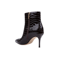 The Houston Bootie is a black, high-heeled ankle bootie with a pointed toe and faux crocodile texture, featuring a side zipper and slender stiletto heel, shown on a white background.