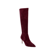 The Herald Boot—a single tall, burgundy suede knee-high boot with a pointed toe and a slender stiletto heel—is displayed on a plain white background, perfect for elevating chic autumn style.