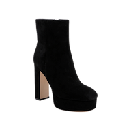The Soho Bootie, a black suede ankle boot with a high platform block heel and side zipper, is showcased against a plain white background.