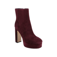 The Soho Bootie, a burgundy velvet platform ankle boot featuring a high block heel, round toe, and side zipper, is displayed on a white background.
