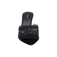 The Penn Mule, viewed from above against a white background, is a black mule featuring a pointed tip, delicate lace detailing over the toe, and a comfortable memory foam insole.
