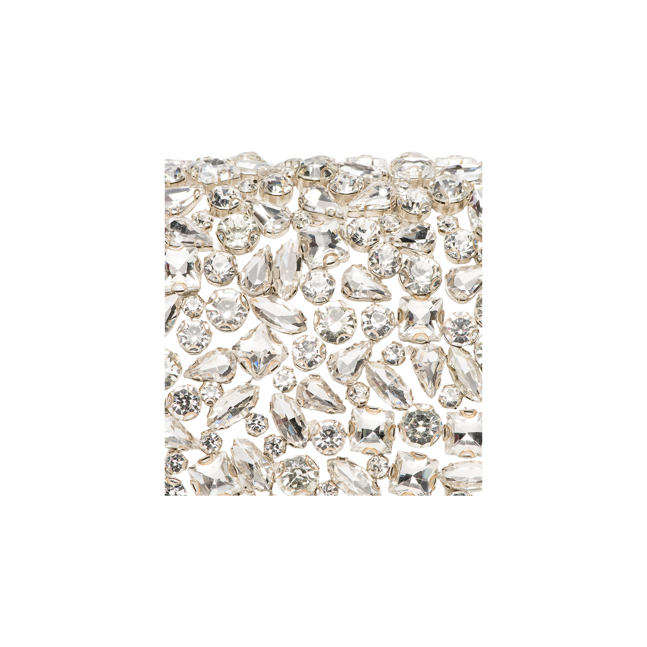 A close-up image of sparkling, handcrafted crystals arranged in a variety of shapes and sizes on a white background, evoking the elegance of the Verve Crystal Clutch collection.