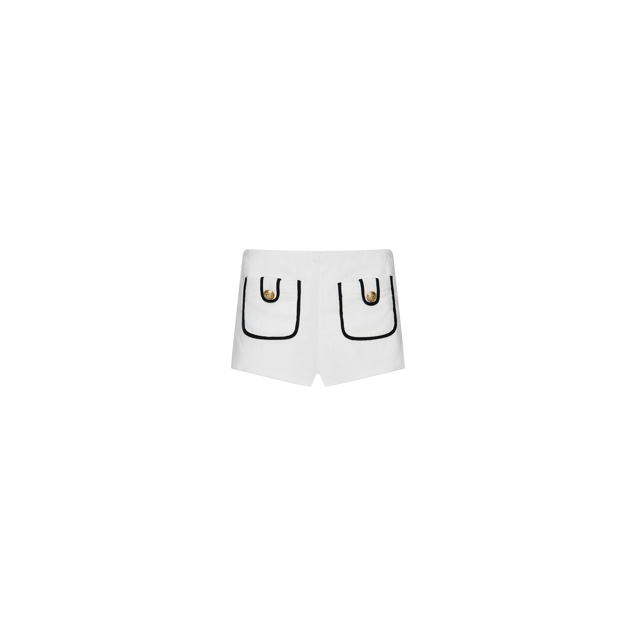 The Amiya Cover-Up Short features white terrycloth fabric with two front pockets, each accented by black trim and a decorative gold button. Designed in a clean, minimalistic hot short style, these shorts are perfect for poolside lounging and are showcased against a plain white background.