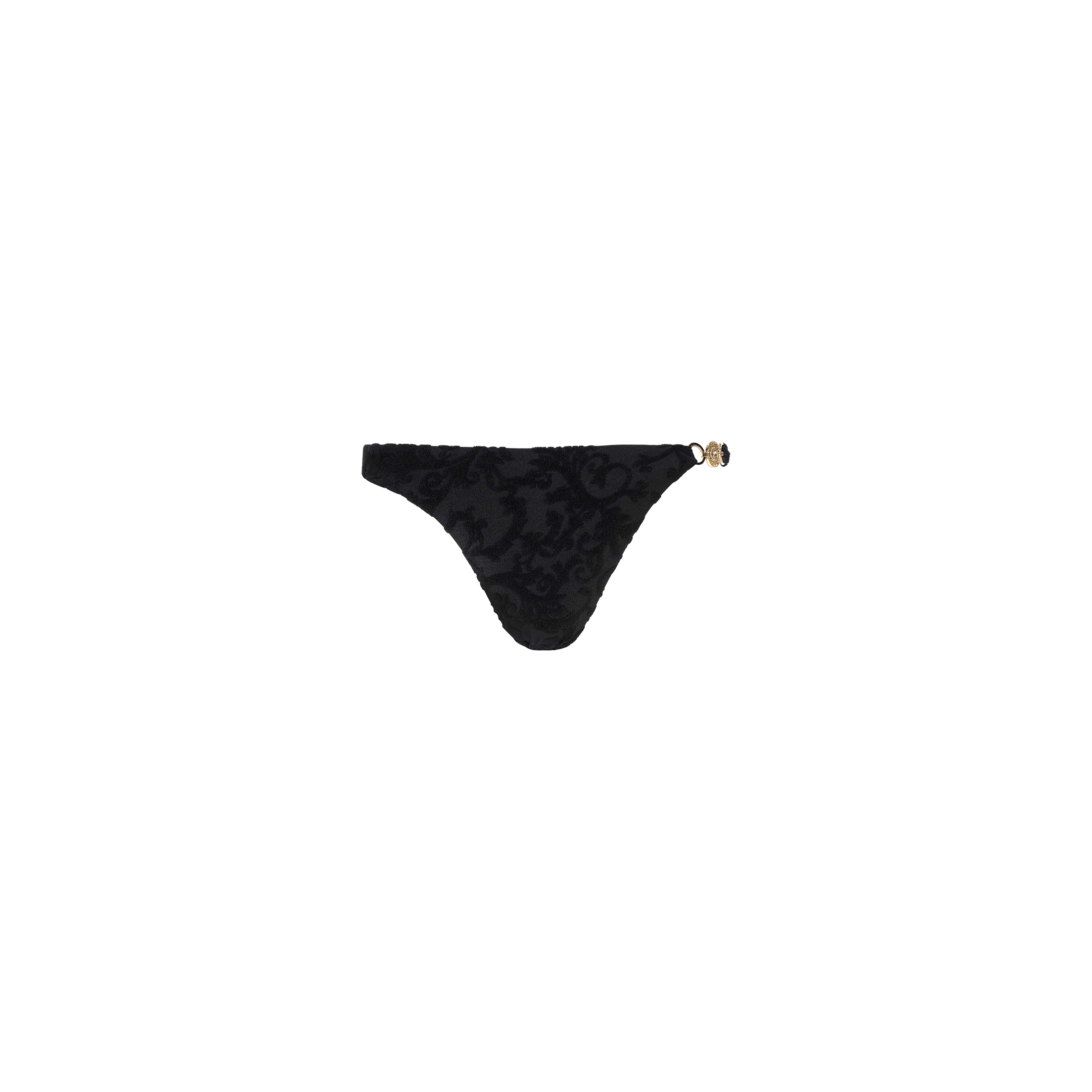 The Jean Bikini Bottom is a timeless black thong bikini bottom with a subtle floral pattern and decorative gold detail on the left hip, featuring a flattering high-leg cut, displayed on a plain white background.