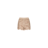 The Laina Eyelet Short features a beige lace design with a scalloped hem and delicate floral patterns, crafted in a lightweight style and presented in an almond tan shade against a plain white background.