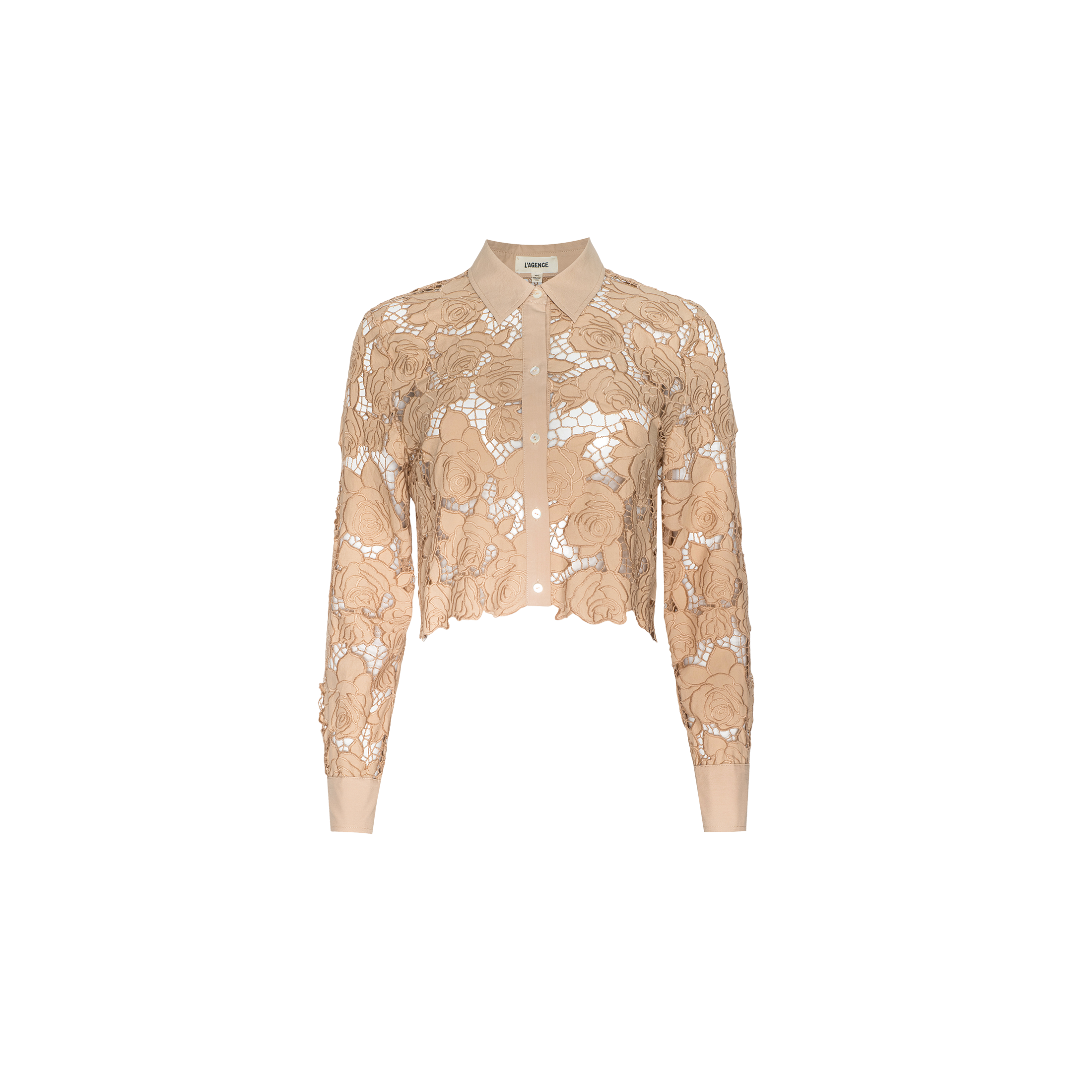 The Seychelle Cropped Eyelet Blouse is a beige, long-sleeve top featuring a collared neckline, button front, and intricate floral lace detailing over sheer fabric, finished with a cropped silhouette and shown against a plain white background.