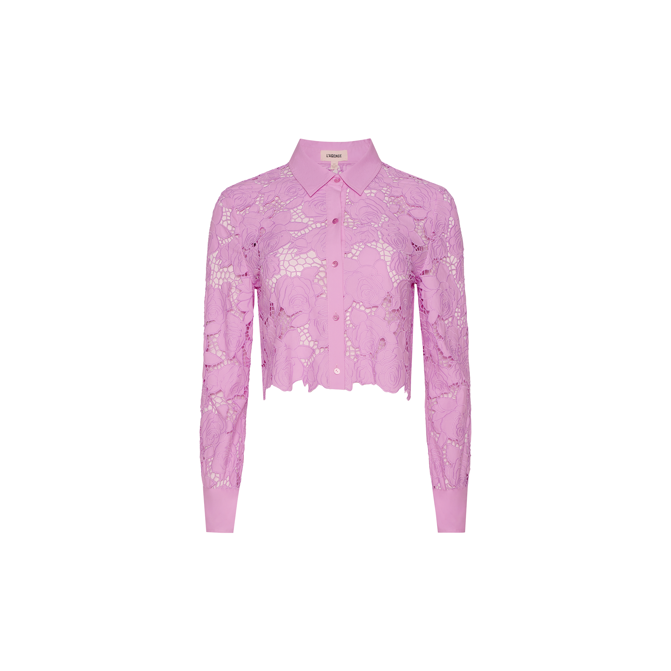 The Seychelle Cropped Eyelet Blouse is a long-sleeve, light purple lace blouse with a collar and button-down front, featuring a cropped hem and delicate floral patterns reminiscent of styles seen in Legally Blonde.